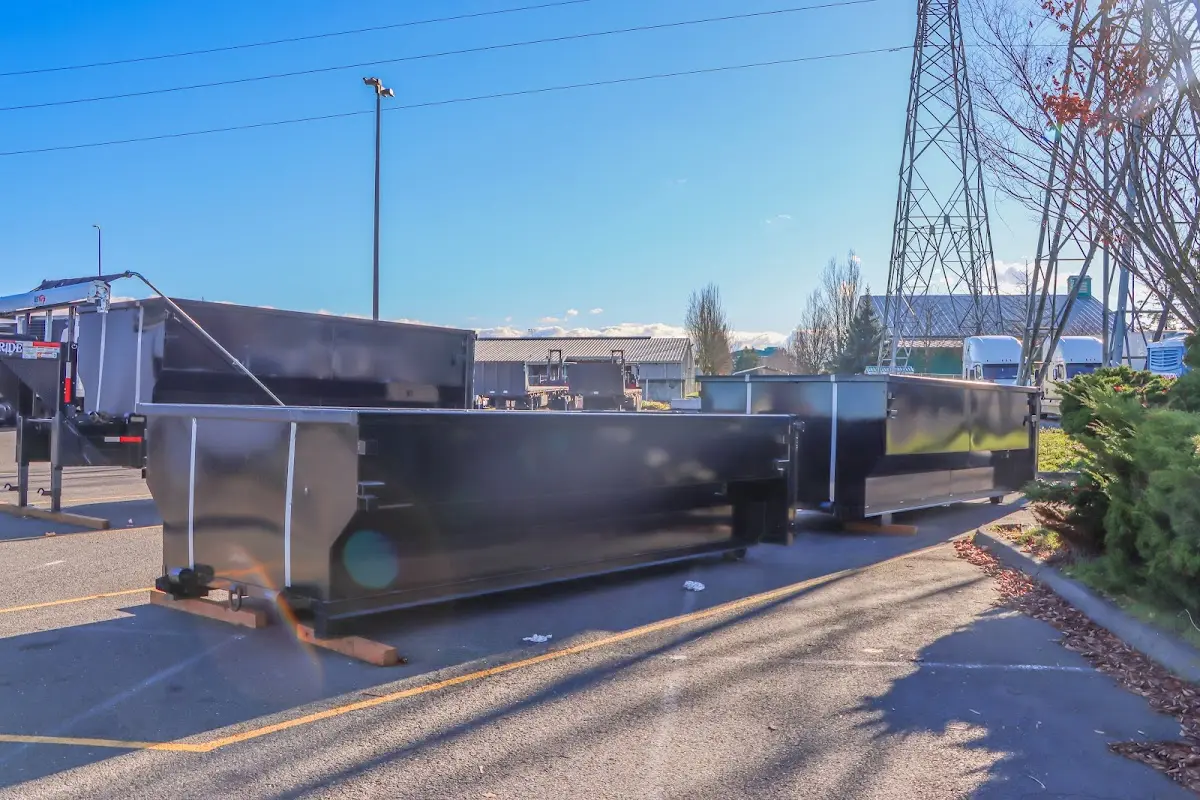 Roll-off dumpster ready for waste disposal at job site for 12 Yard Dumpster Rental in Orange Beach